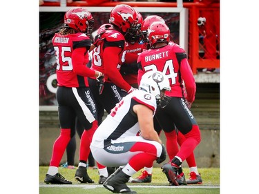 The Calgary Stampeders' Jamar Wall celebrates with teammates after his interception for a touchdown.