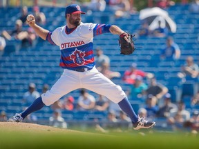 Éric Gagné pitches for the Ottawa Champions during a game against the Quebec Capitales at the Raymond Chabot Grant Thornton Park in Ottawa Mon., September 5, 2016. The 40-year-old National Baseball League all-star grew up in the small town of Mascouche, near Montreal, Quebec.