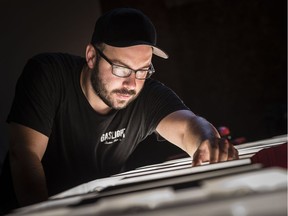 Scott Adamson, founder of Gaslight Electric Sign Co., works on the second marque-style sign he's made for Kettleman's Bagel Co. while in his Almonte workshop Tuesday, August 16, 2016. Adamson, a photographer and designer, has made signs for many Ottawa restaurants and coffee shops.