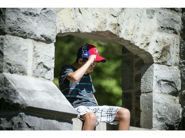 Ten-year-old Alex Halal sits in one of the ruins at Kingsmere.