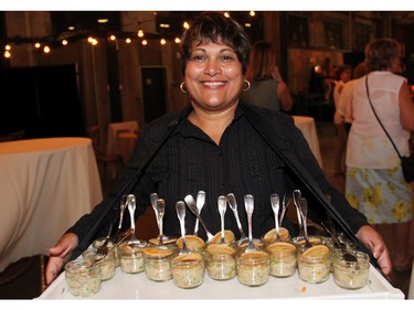 That's Judy Cardinal serving chicken pot pie at a party hosted by Thyme & Again Creative Catering and Take Home Shop on Friday, September 9, 2016, at the Horticulture Building in celebration of its 25th anniversaray. (Caroline Phillips / Ottawa Citizen)