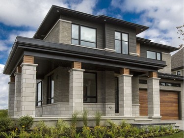 Front: Although based on Minto’s Okanagan model, the dream home has been customized and designed to take full advantage of the preserved Mahogany Creek greenspace that runs alongside the lot on one side (on the other is the 2014 dream home). Clad in brick and stone, with charcoal and cedar-look siding accents, the modern elevation returns after it proved popular on last year’s home.