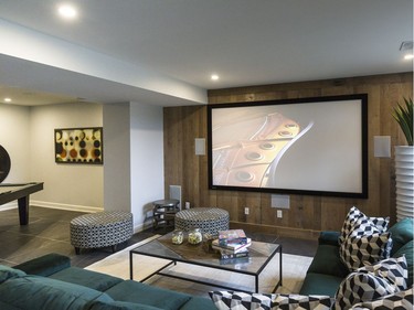 Home theatre: A new product for Potvin, a rough-sawn oak veneer gives a rustic look to the home theatre wall. ‘It’s like reconstituted barn wood, almost,’ says Potvin’s Daniel Gauthier. A 130-inch projection screen and Dolby Atmos surround sound system make for a much more immersive experience, says Audioshop’s Brad Boyle.
