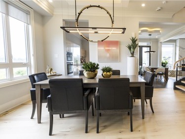 Dining chandelier: Inspired by a designer's jewelry concepts, the Theta pendant by Hubbardton Forge, available through Living Lighting, mixes textured steel, polished aluminum and LED technology for a modern industrial sculptural look over the dining room table.