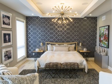 Master bedroom: The master suite is one of the more glamorous rooms in the home, with its double-door entry, metallic wallpaper, starburst chandelier and layers of texture. ‘There’s a sense of glamour, yet it’s a relaxed glamour,’ notes associate designer Tracey Woodman, as evidenced by the retro vibe in the furnishings.