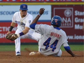 The Ottawa Champions' Kenny Bryant slides into second base during the fifth and deciding game of the Can Am League final against the Rockland Boulders.