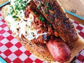 The Red Apron's new Chili Dog is made with an Enright Farm all-beef hot dog, topped with Fitzroy Beef Chili and St-Albert's Cheddar, all on a house made bun.