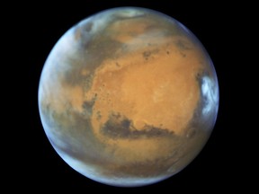This May 12, 2016 image provided by NASA shows the planet Mars. On Sunday, May 22, 2016, the sun and Mars will be on exact opposite sides of Earth. (NASA/ESA/Hubble Heritage Team - STScI/AURA, J. Bell - ASU, M. Wolff - Space Science Institute via AP)