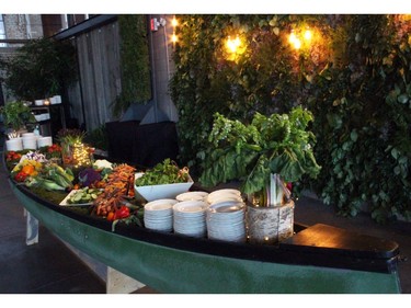 Thyme & Again Creative Catering lived up to its name with this creative presentation of a summer harvest salad bar in a canoe, complemented by a live wall of greenery, at its 25th anniversary party, held Friday, September 9, 2016, at the Horticulture Building at Lansdowne. (Caroline Phillips / Ottawa Citizen)