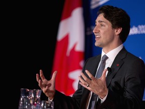 Prime Minister Justin Trudeau, shown here at a Canada 2020/Centre for American Progress lunch in Washington, DC last March, will engage in an "armchair discussion" with London Mayor Sadiq Khan.