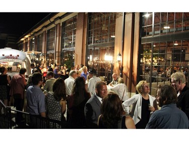 Warm evening temperatures allowed for guests to mingle on the patio outside the Horticulture Building at the 25th anniversary party hosted by Thyme & Again Creative Catering and Take Home Food Shop on Friday, September 9, 2016. (Caroline Phillips / Ottawa Citizen)