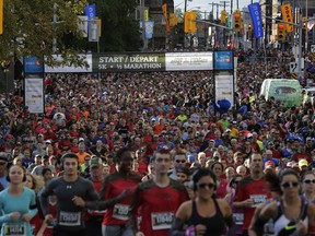 Waves of runners make their way up Elgin Street at the start of the Canada Army Run on Sept. 18, 2016. Over 20,000 participants ran, walked or rolled along side members of the Canadian Armed Forces in the annual fundraiser race for Soldier On and the Military Families Fund. (David Kawai)