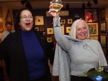 Well-known community leader Barbara McInnes, right, gets a birthday serenade from Ottawa singer Maria Hawkins at PAL Ottawaís benefit soirée, held at Cube Gallery on Wellington Street West on Thursday, September 29, 2016.