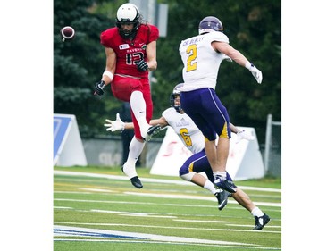 Wilson Birch of the Carleton Ravens jumps to try to catch the ball during the game against Laurier Golden Hawks.