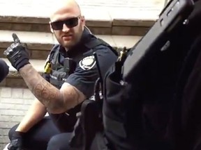 A YouTube video screen grab of Const. Daniel Montsion, who made $164,000 last year. Montsion was charged with manslaughter and assault in the death of Abdirahman Abdi last summer.