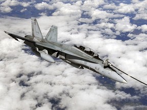 This file photo shows a CF-18 refueling. Photo by Larry Wong, Edmonton Journal