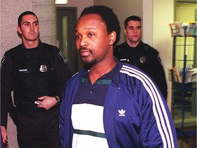 Robert Sarrazin surrenders to police in the shooting of Apaid Noel in this 1998 file photo.