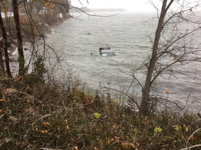 Two people were rescued from this submerged vehicle by passersby.