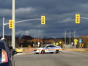 An Ottawa police cruiser blocks off Highway 174 at Trim Road following a fatal crash involving a school bus on Monday, Oct. 24, 2016.