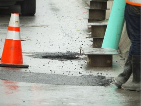 A small sinkhole opened up on Rideau Street near the corner of Sussex Sunday October 2, 2016.    Ashley Fraser / Postmedia