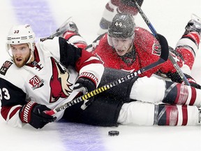 Alex Goligoski (L) and JG Pageau collide in the second period as the Ottawa Senators take on the Arizona Coyotes in NHL action at the Canadian Tire Centre.  photo by Wayne Cuddington/ Postmedia