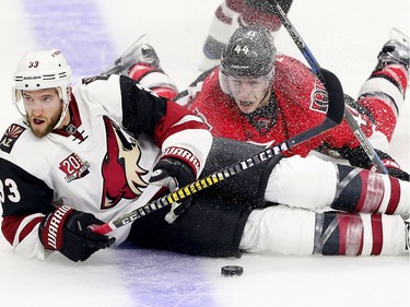 Alex Goligoski (L) and JG Pageau collide in the second period as the Ottawa Senators take on the Arizona Coyotes in NHL action at the Canadian Tire Centre.  photo by Wayne Cuddington/ Postmedia