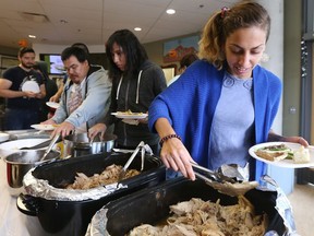 The Mamidosewin Centre at Algonquin College has a monthly feast for students. The one pictured here was also a Thanksgiving feast. Student Sumaya Aliphai is seen serving herself.