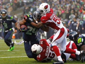 Wanting to improve the pass rush has led the Redblacks to sign former NFLer Marcus Benard, seen above playing for the Arizona Cardinals against the Seattle Seahawks on December 22, 2013 at CenturyLink Field in Seattle, Washington.