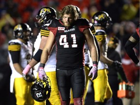 The Ottawa Redblacks' Arnaud Gascon-Nadon holds his helmet after Ottawa was called for pass interference against the Hamilton Tiger-Cats during overtime on Friday, Oct. 21, 2016.