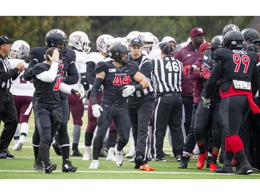 A shoving match breaks out before the game between the Carleton Ravens and University of Ottawa Gee-Gees at MNP Park on Saturday, Oct. 29, 2016.