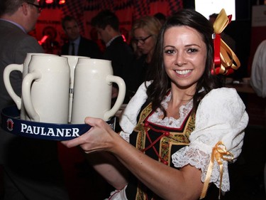 Bier Markt server Brenna Haber makes hauling around four litres-worth of beer look easy, at the Capital Oktoberfest benefit for the University of Ottawa Heart Institute, held at the Bier Markt restaurant on Sparks Street on Wednesday, October 5, 2016.