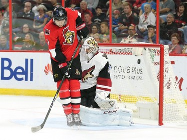 Bobby Ryan deflects a shot past Mike Smith for a goal in the first period.