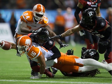 B.C. Lions' Bryan Burnham (16) dives for the goal line but is stopped just short by Ottawa Redblacks' Forrest Hightower, second left, during the first half of a CFL football game in Vancouver, B.C., on Saturday October 1, 2016.
