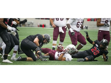 The Gee-Gees' Bryce Vieira is brought down.
