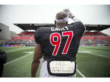 The Carleton Ravens' Stefan Carty waves goodbye to the Gee-Gees' fans leaving the stadium early during the 48th Panda Game.