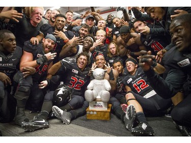 The Carleton Ravens celebrate their Panda Game victory.