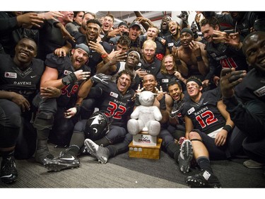 The Carleton Ravens celebrate their Panda Game victory.