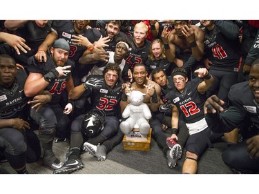 The Carleton Ravens celebrate their Panda Game victory.