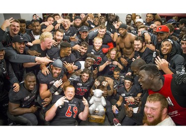 The Carleton Ravens celebrate their Panda Game victory.