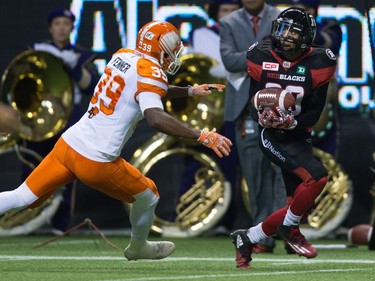 Ottawa Redblacks' Chris Williams, right, makes a reception before running it for a touchdown as B.C. Lions' Chandler Fenner defends during the first half of a CFL football game in Vancouver, B.C., on Saturday October 1, 2016.
