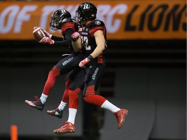 Ottawa Redblacks' Chris Williams, left, and Greg Ellingson celebrate Williams' touchdown against the B.C. Lions during the first half of a CFL football game in Vancouver, B.C., on Saturday October 1, 2016.