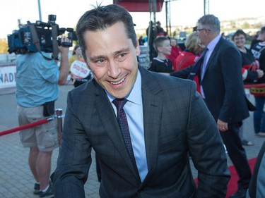 Coach Guy Boucher greets fans during the red carpet event as the Ottawa Senators get set to take on the Toronto Maple Leafs in NHL action at the Canadian Tire Centre. Wayne Cuddington/ Postmedia