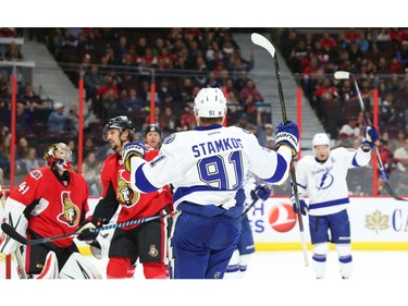 Craig Anderson and Erik Karlsson of the Ottawa Senators react after a goal by Steven Stamkos of the Tampa Bay Lightning.