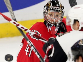 Craig Anderson has his eye on the puck in the second period as the Ottawa Senators take on the Arizona Coyotes in NHL action at the Canadian Tire Centre.  photo by Wayne Cuddington/ Postmedia