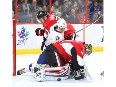 Craig Anderson of the Ottawa Senators makes the save as Mark Borowiecki battles against Brayden Point of the Tampa Bay Lightning during the second period at the Canadian Tire Centre on Saturday, Oct. 22, 2016.