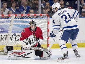 Ottawa Senators goalie Craig Anderson stops a shot from Toronto Maple Leafs center Peter Holland during the second period of an NHL pre-season hockey game in Saskatoon, Tuesday, October 4, 2016.