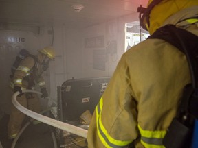 This file photo shows Canadian Forces members on a training exercise to deal with a simulated fire. Photo courtesy DND