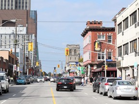 Elgin Street's sidewalks are passable without patios on them, but a city experiment with adding patios in front of some pubs and restaurants has squeezed pedestrians onto the streets on some stretches.