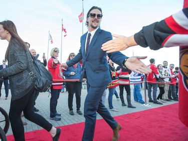 Erik Karlsson greets fans on the red carpet as the Ottawa Senators get set to take on the Toronto Maple Leafs in NHL action at the Canadian Tire Centre. Wayne Cuddington/ Postmedia