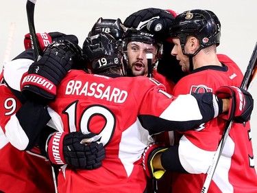 Erik Karlsson is congratulated on his power play goal with Derick Brassard, Marc Methot, Ryan Dzingel and Bobby Ryan in the first period.